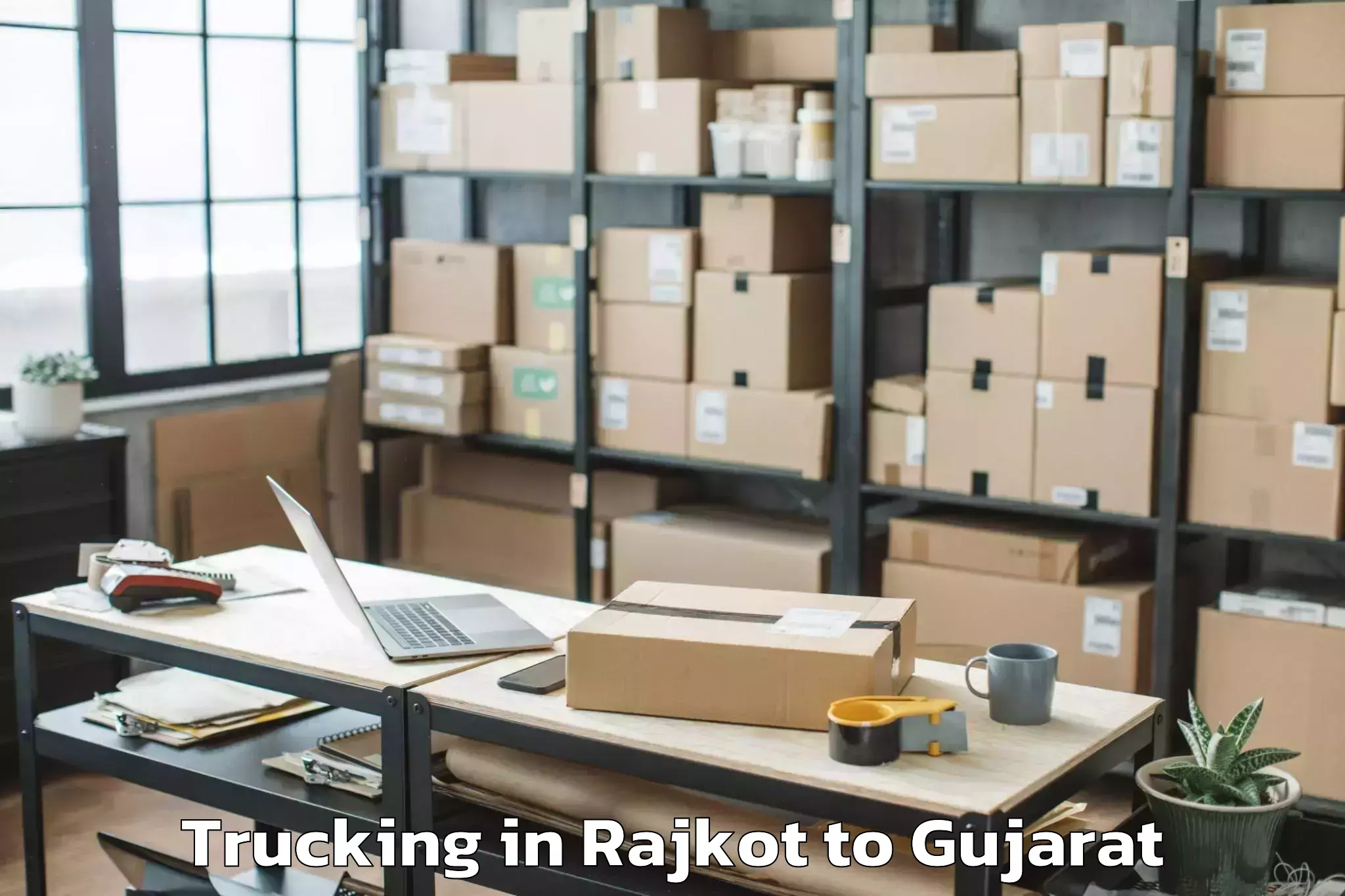 Trusted Rajkot to Tilakwada Trucking